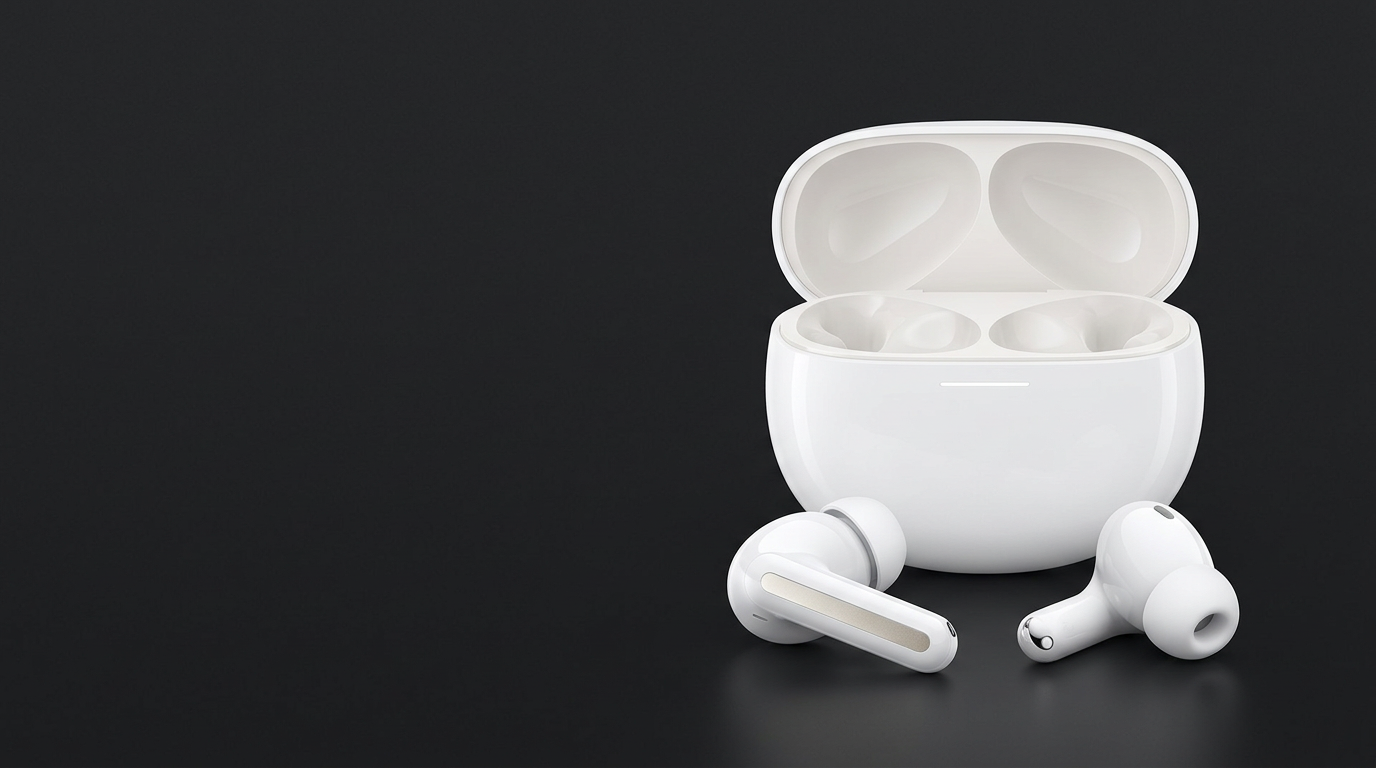 Estuche abierto y dos audífonos in-ear con almohadillas de silicona